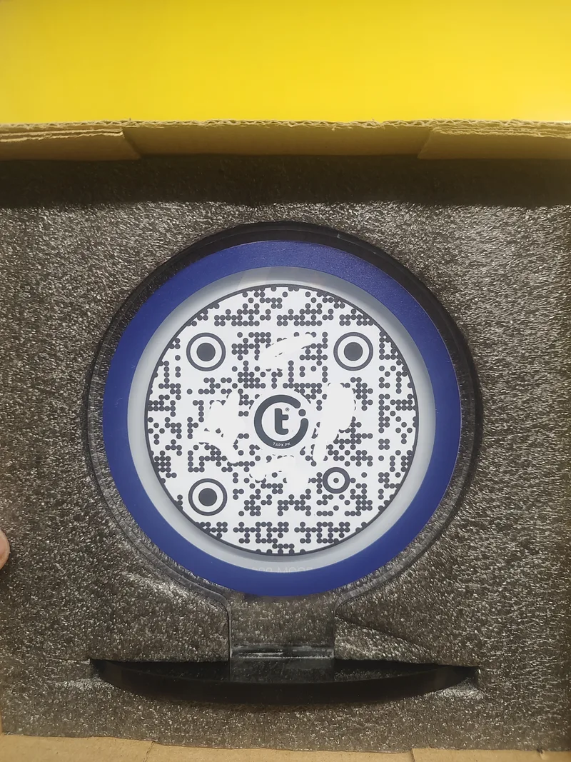 Reverse of the GolTap with the actual TapX-branded QR code in protective packaging